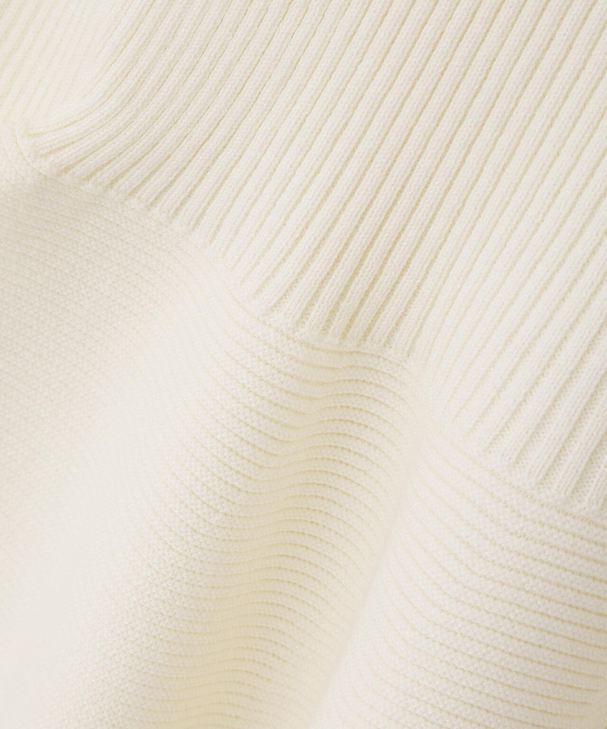 フェザートリムペプラムニット