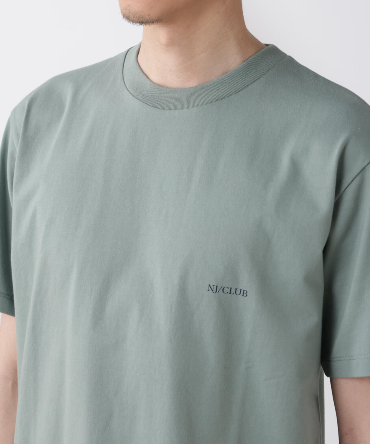 「NJ/CLUB」 ISLANDCLUBプリント Tシャツ